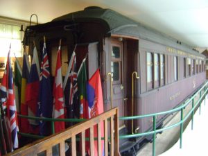A railway carriage decorated with flags
