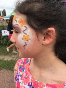 A girl shows off her face paint at the Eurocamp kids club